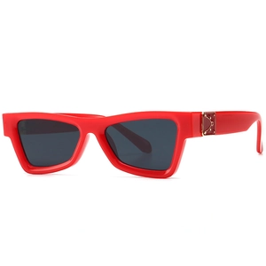 Retro red cat-eye sunglasses with wide frames and gold metal accents for trendy street style