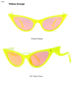 Detail view of cat-eye sunglasses with wavy temples and pink reflective lenses