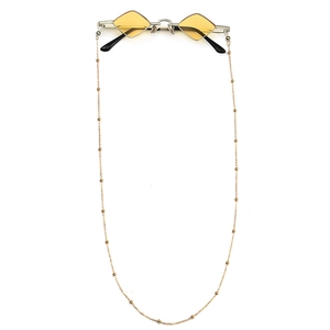 Vintage retro sunglasses with yellow diamond lenses and gold beaded link chain accessory