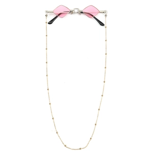 Retro round sunglasses with pink diamond lenses and decorative gold beaded chain