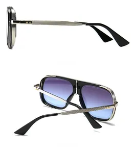 Dettaglio occhiali da sole aviator in metallo argento con lenti sfumate e texture