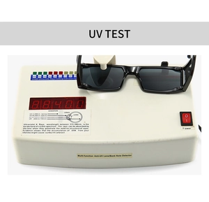 Detail showing UV400 test result on a specialized meter for black square sunglasses
