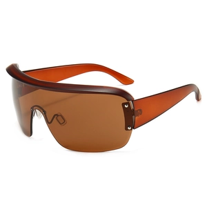Modern oversized wrap-around sunglasses with amber lenses and translucent frames