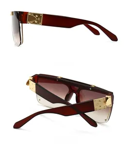 Side and back view of retro mask-style oversized sunglasses with gold metal rivets