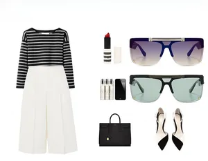 Flat lay of modern mask sunglasses styled with striped top and wide-leg trousers