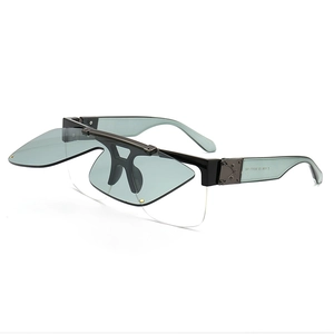 Modern retro flip-up sunglasses with blue lenses and black frame in a 3/4 side view