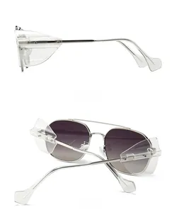 Detail view of silver metal punk sunglasses with folding transparent side shields and gradient lenses