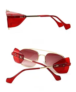 Detail view of steampunk sunglasses with side shields and golden metal frames