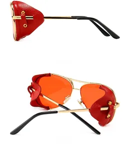 Detail view of steampunk aviator sunglasses with red leather side shields and gold frame
