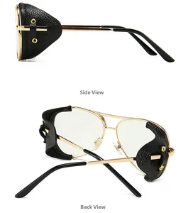 Detail of gold metal frame sunglasses with black leather side shields and rivets