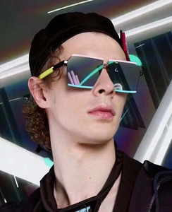 Macro detail of oversized geometric sunglasses with neon contrast lining and stylish frame