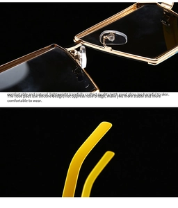 Detail of the soft silicone nose pads and yellow temple tips on golden metal sunglasses