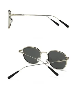 Detail view showing the sleek side and back profiles of vintage round metal sunglasses