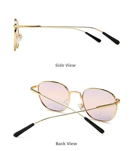 Detail view of round metal sunglasses with gold frames and purple-pink gradient lenses