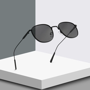 Retro round metal sunglasses with thin black frames and dark lenses for a modern look