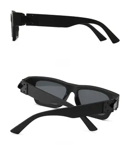 Detail of matte black thick-frame sunglasses with retro metal rivet studs on the side
