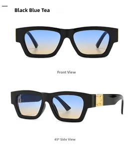 Detail of square black sunglasses with blue tea gradient lenses and gold metal accents