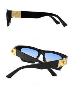 Detailed side and back view of retro black sunglasses with gold C-shaped metal decor