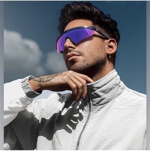 Close-up of men's TR polarized sunglasses with purple mirrored lenses worn outdoors