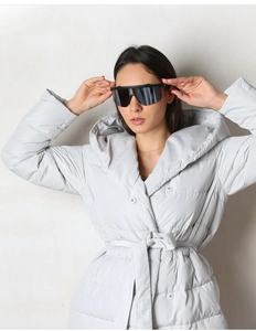 Close-up of light gray quilted hooded down jacket featuring a matching waist belt and sleek design