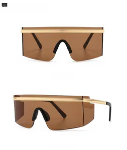 Detailed front and side view of oversized shield sunglasses with gold woven metal top bar