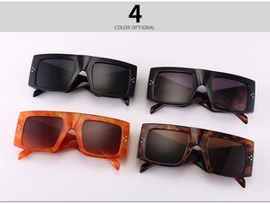 Flat lay of four vintage oversized square sunglasses in assorted tortoiseshell colors