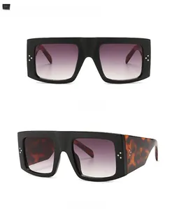 Flat top square sunglasses with black frames and tortoise temples in dual views