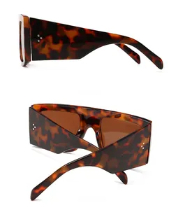 Detail view of retro flat top sunglasses with tortoiseshell frame and silver rivets