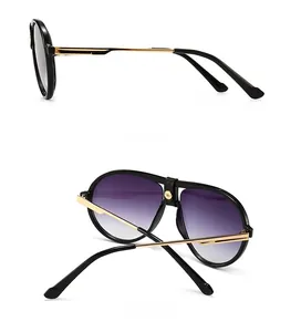 Detail view of aviator sunglasses with gradient purple lenses and leather bridge wrap