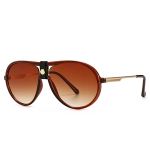 Classic pilot sunglasses with amber frames and black leather bridge detail