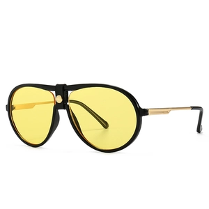 Classic aviator sunglasses with black frame, yellow transparent lenses and gold metal temples