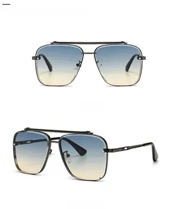 Detail of square pilot sunglasses with black metal frame and blue yellow gradient lenses