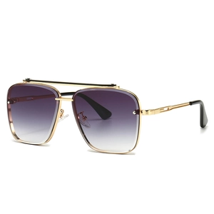 Modern retro navigator sunglasses with gold metal frame and gradient purple lenses