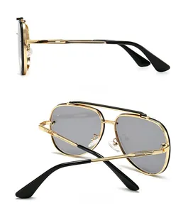 Side and back view of retro pilot sunglasses with gold metal frame and dark grey lenses