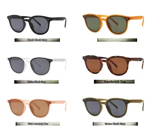 Various colors of retro oversized sunglasses with stylish rivet details on a white background
