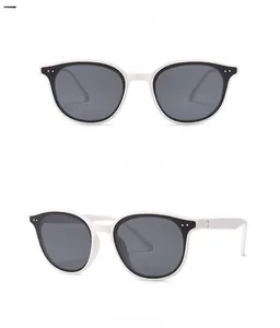 Front and 45-degree side view of white rivet sunglasses with black contrast and grey lenses
