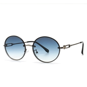 Lunettes de soleil rondes rétro avec verres dégradés bleus et monture métallique