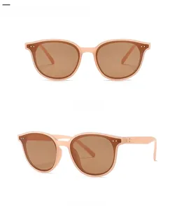Front and side view of retro rivet sunglasses in pink lucency tea color