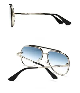 Detail view showing side and back of silver metal aviator sunglasses with blue gradient lenses