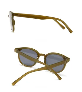 Detail view of dark green rivet sunglasses showing side and back frame profiles