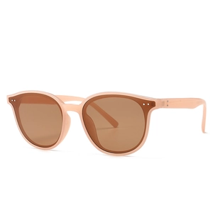 Classic retro sunglasses in pale pink with brown lenses and metal rivet accents
