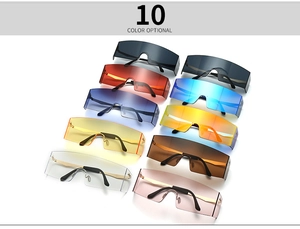 Flat lay display of oversized rimless sunglasses in ten vibrant gradient colors