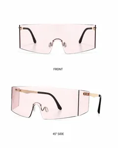 Close-up of gold pink gradient rimless sunglasses with metal temples and nose pads