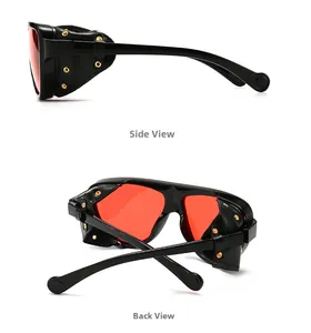 Détail de lunettes steampunk avec verres rouges, protections en cuir et clous dorés