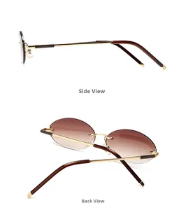 Detail view of oval rimless sunglasses with gradient brown lenses and golden metal temples