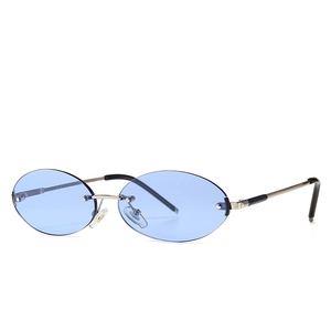 Retro oval rimless sunglasses with blue transparent lenses and metal temples for street style