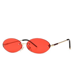 Retro oval rimless sunglasses with red lenses and elegant gold metal frame