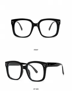 Detail view of black transparent square sunglasses featuring classic silver metal rivets