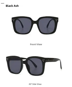 Detail of square black sunglasses with silver rivet accents and grey lenses from two angles