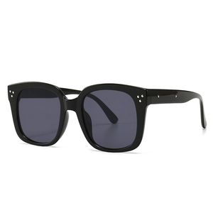 Modern square frame sunglasses in black with metal rivet accents and dark lenses